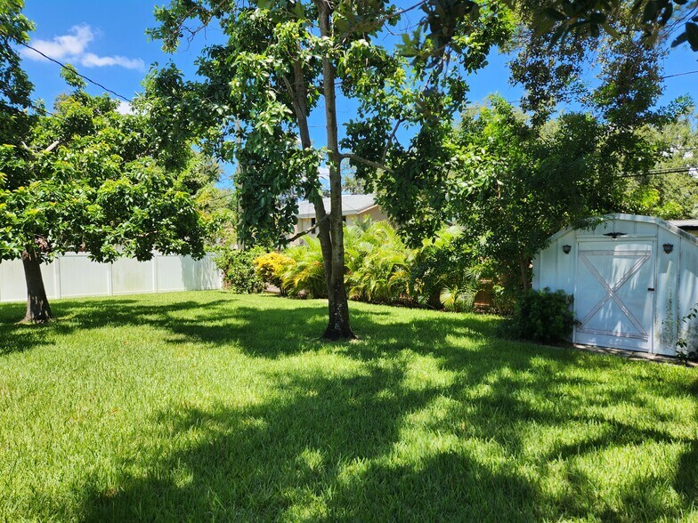 Large private back yard with avocado trees - 8215 32nd Ave N