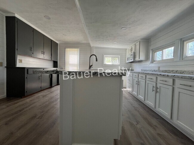 Building Photo - Renovated Three Bedroom Home