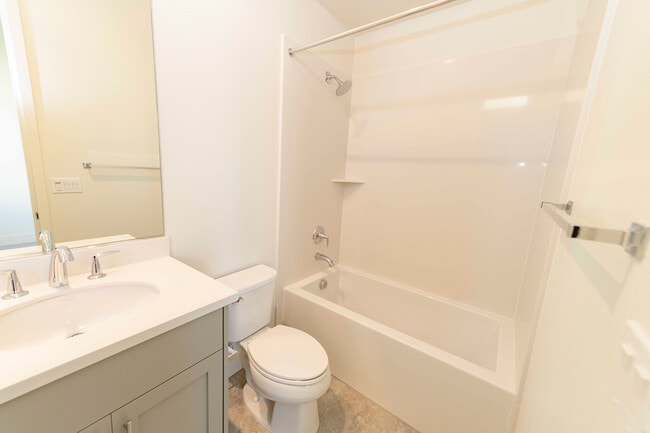 Building Photo - Experience contemporary urban living at its finest. Private Garage & Dual Suites!