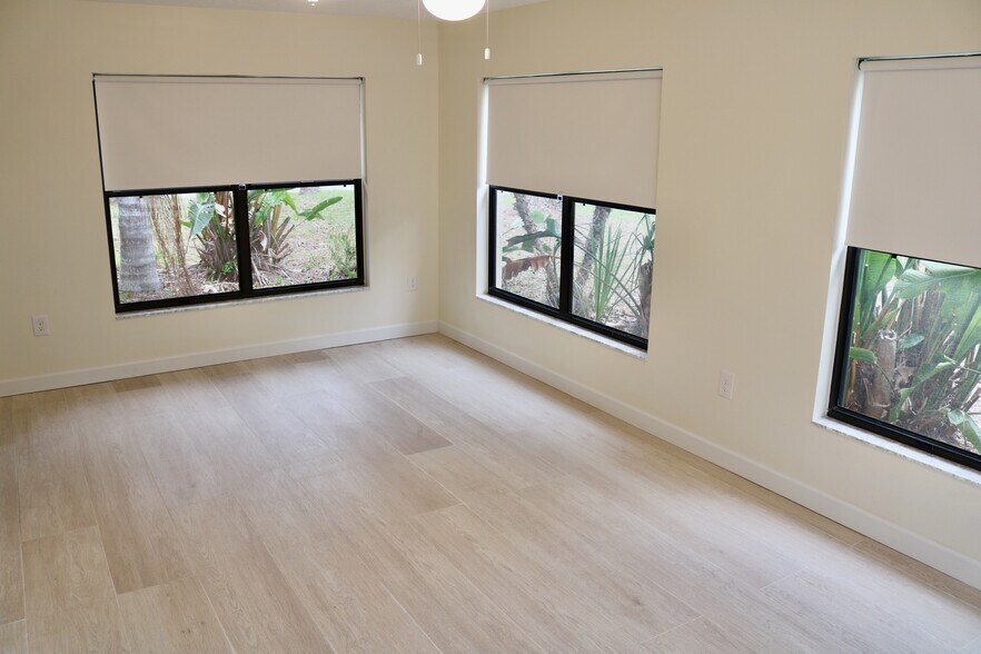 Expansive great room with plenty of natural light and blackout shades. - 33 63rd St