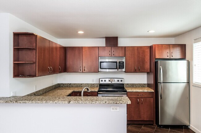 Building Photo - **Updated 2-Bedroom Condo with Secure Parking, In-Unit Laundry & Utilities Included**