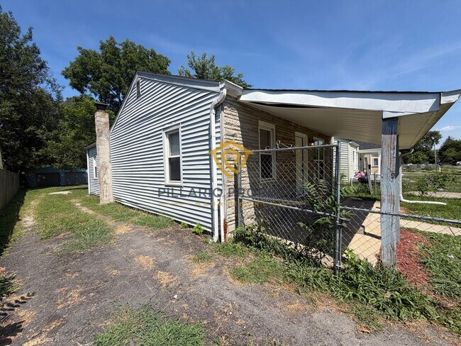Building Photo - Charming 3-Bedroom Stone Bungalow with 2-Car Detached Garage & Fenced Yard, Available NOW!
