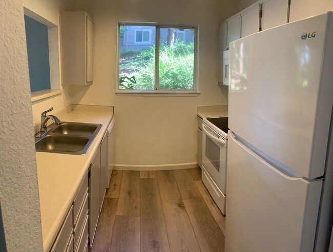 Building Photo - $1,700 - One Bedroom Condo, INCLUDES WATER...