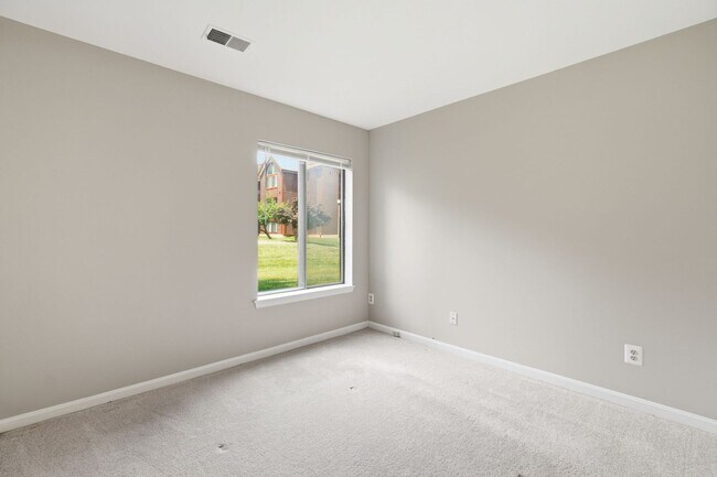 Building Photo - Contemporary design meets exceptional space in this inviting ground level residence, offering eff...