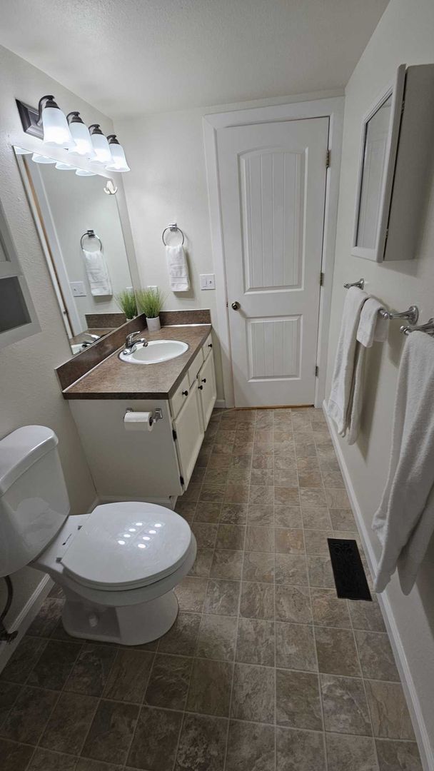 Building Photo - Charming updated 3 bed 1 bath ranch style home with double car garage and large fenced back yard.