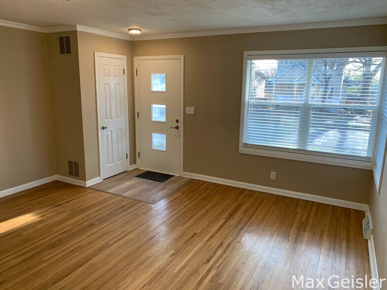 Cozy living room with view of family neighborhood. - 404 12th Ave N