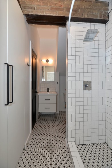 Tiled bathroom with built-in wardrobe - 1713 Locust St