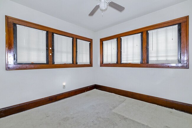 Building Photo - Charming 3BR Home with Classic Woodwork, Porch & Bonus Attic Space