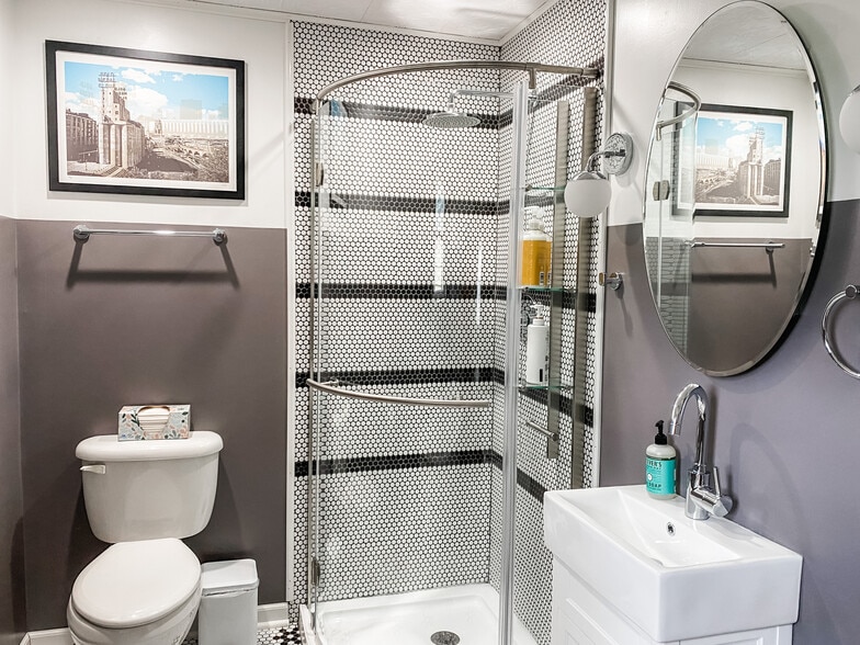 Tiled corner shower - 1012 Englewood Ave