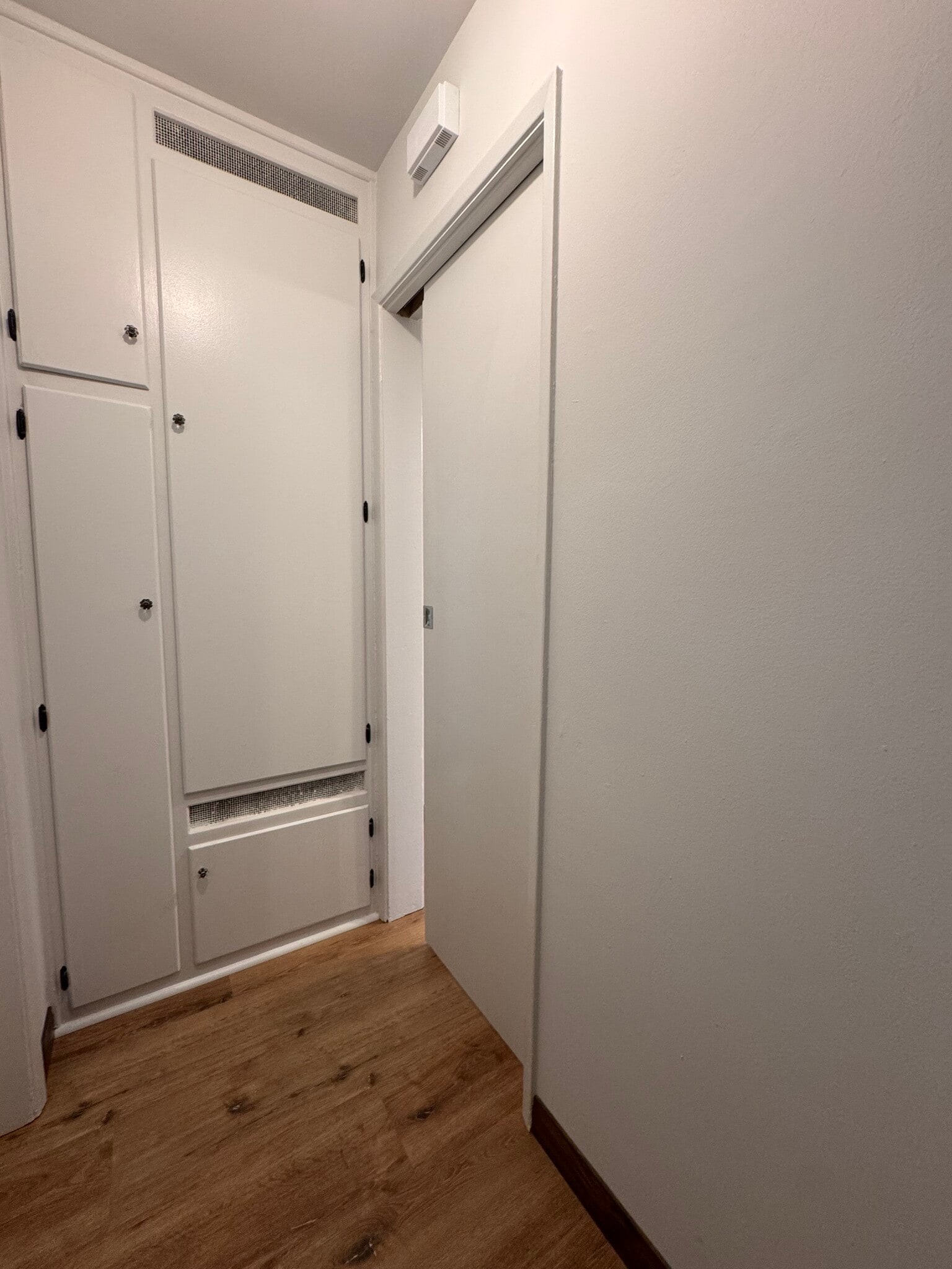 Hallway storage with pocket door for privacy - 1016 Western Ave
