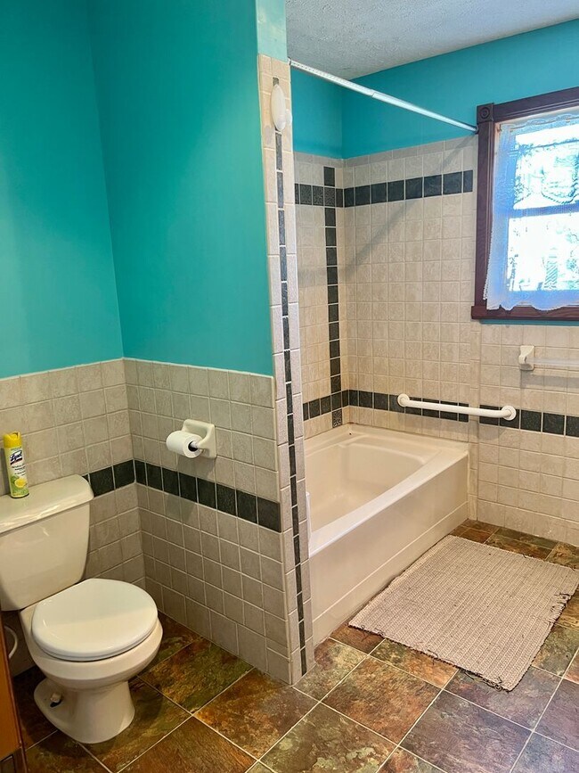 Building Photo - Country living! 1st floor laundry 3+ car garage with work shop