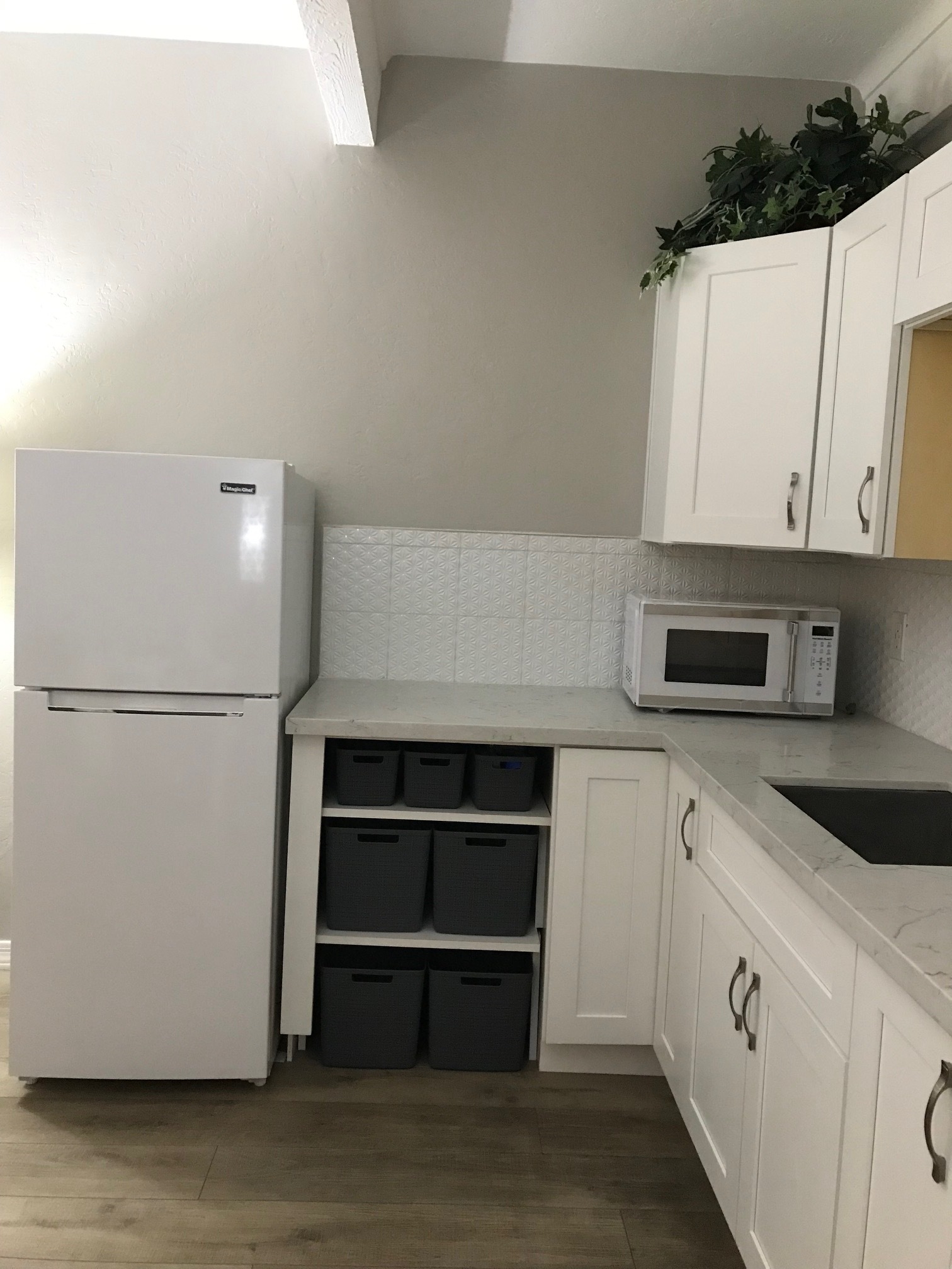 Kitchenette showing shelves for storage area and fridge, microwave, sink - 7350 N Pima Rd