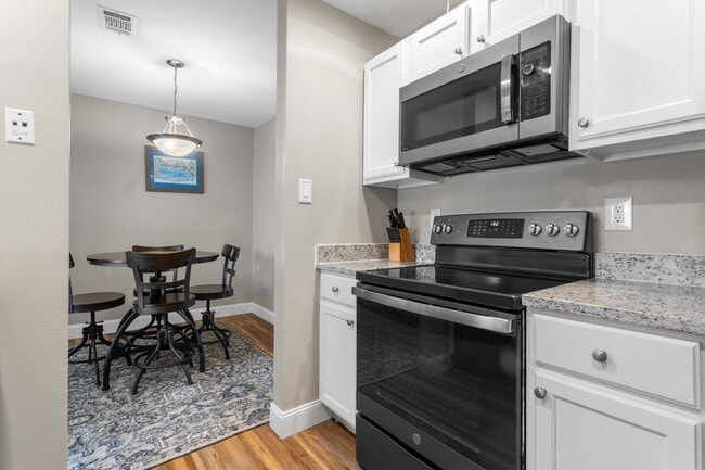 Building Photo - Welcome to Coastal Living at Harbor Landing Condominiums!