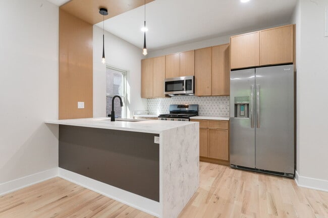 Building Photo - 6410 S Vernon Ave