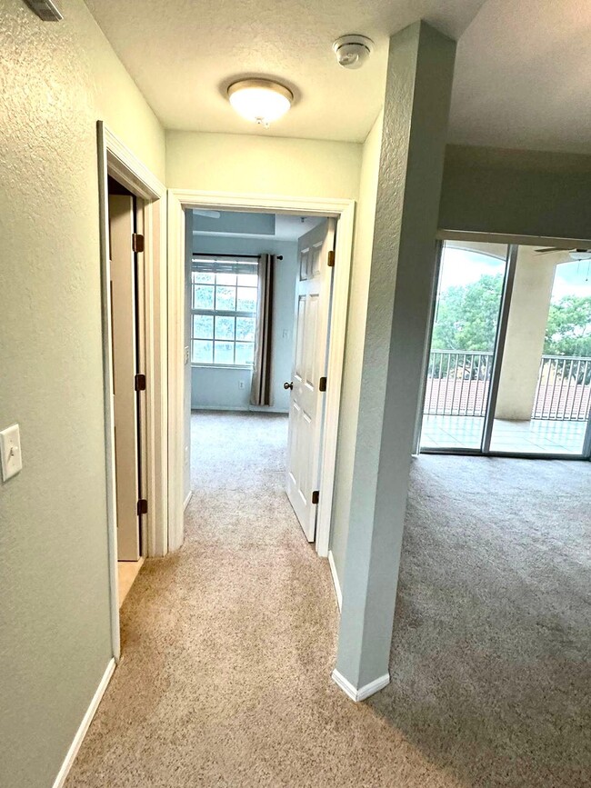 Walk way to 2nd bedroom - 9035 Colby Dr