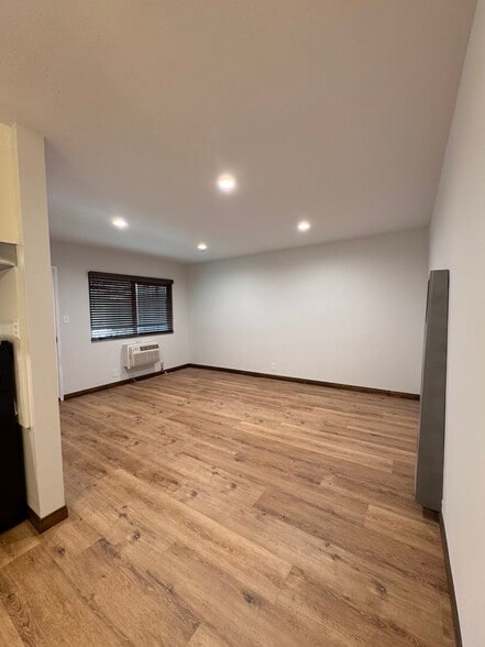 Size-able living room with wall A/C and heat - 1016 Western Ave