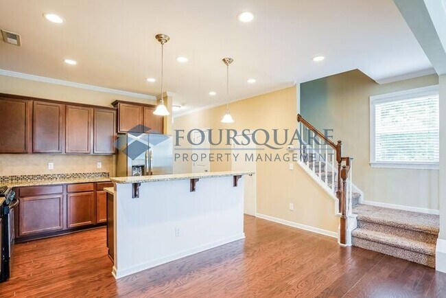 Building Photo - End Unit Townhome | Back Patio With Privac...