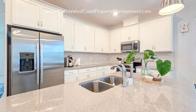 Building Photo - EXCEPTIONAL AND SPACIOUS FURNISHED TOWNHOME WITHIN WATERSIDE- NAUTIQUE!