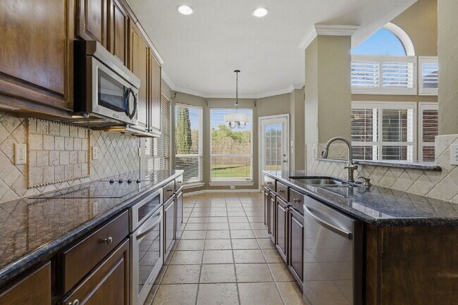Building Photo - "Exceptional 3-2.5-2 with Flexible Living and Greenbelt Privacy!"