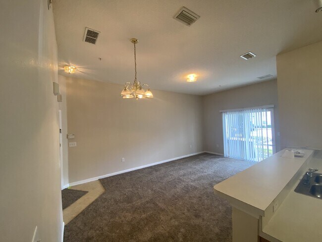 Building Photo - First-Floor 2BR/2BA Condo in Gated Nature’s Hideaway – Pool, Playground & Convenient Westside Loc...