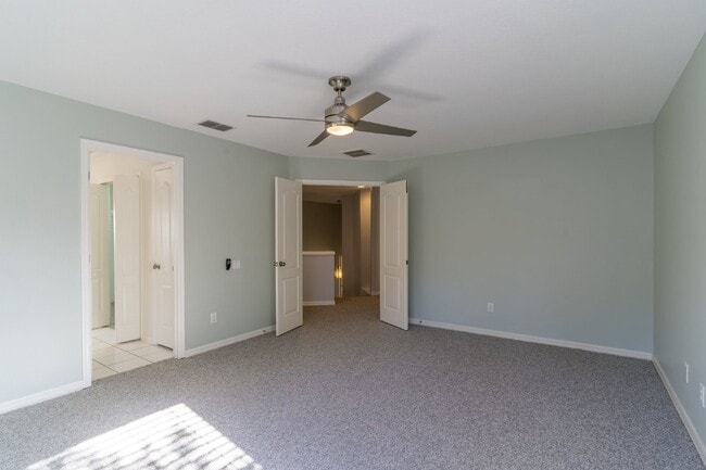 Building Photo - Beautiful 4/2 home Located on a tree lined street in the gate of country club community of the Hu...