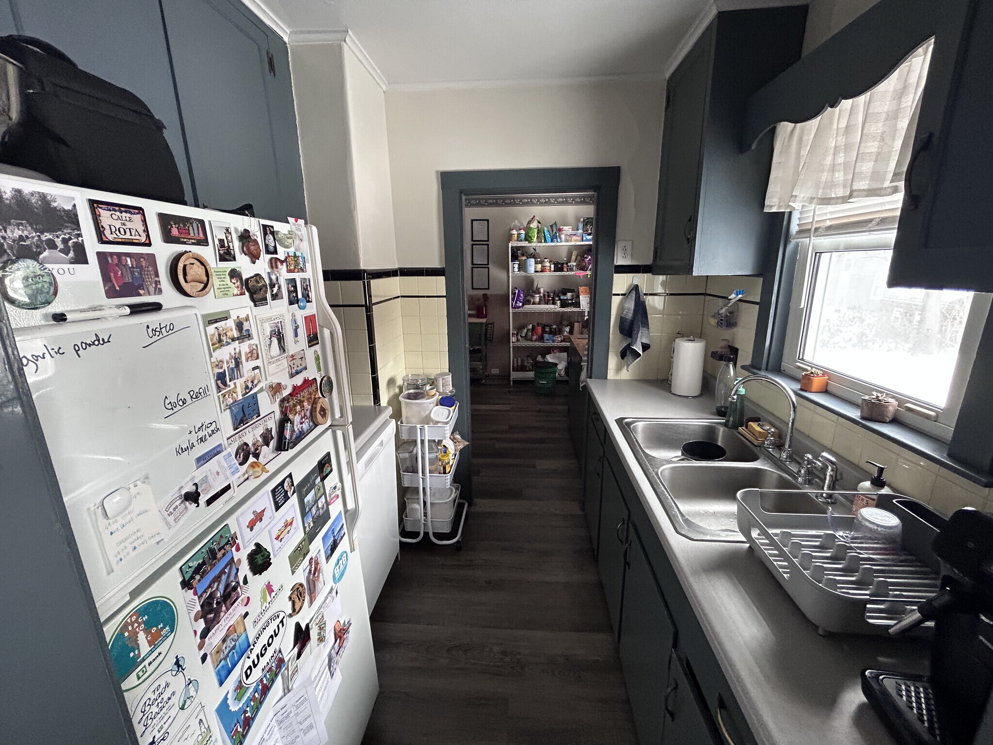 The galley kitchen opens to the main kitchen and also the dining room - 23 E Kidder St