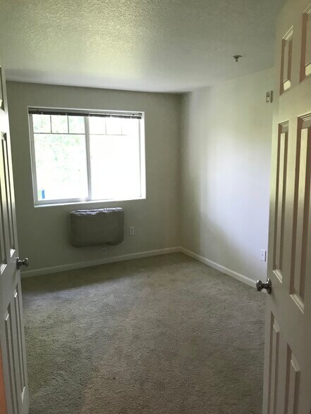 Secondary bedroom with air conditioner - 730 NW 185th Ave