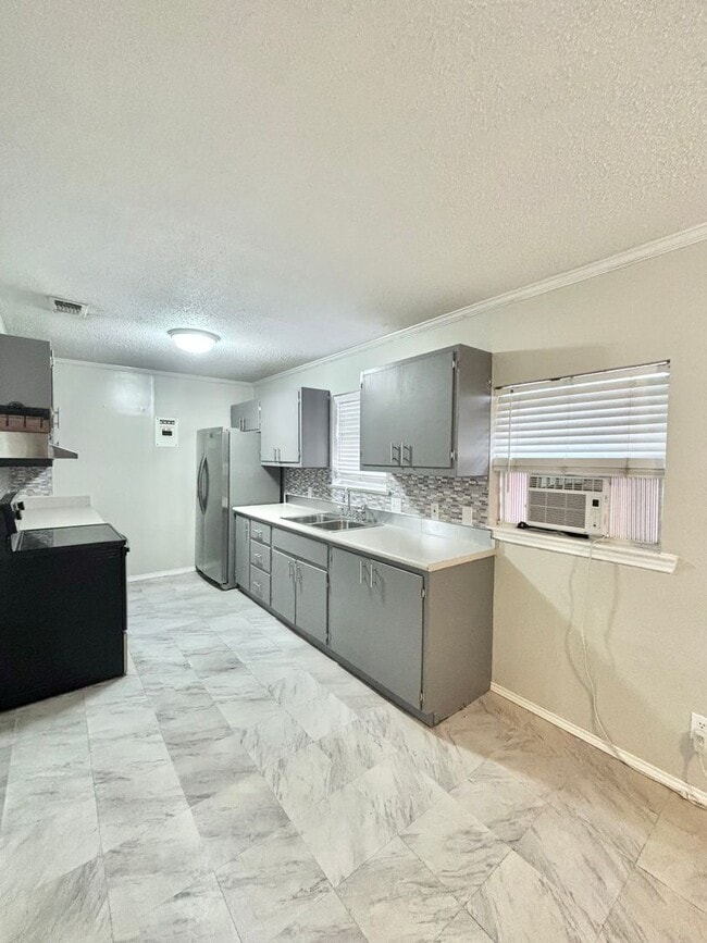 Building Photo - NOW AVAILABLE - Spacious 3-Bedroom Home + Fenced Backyard & Storage Building!