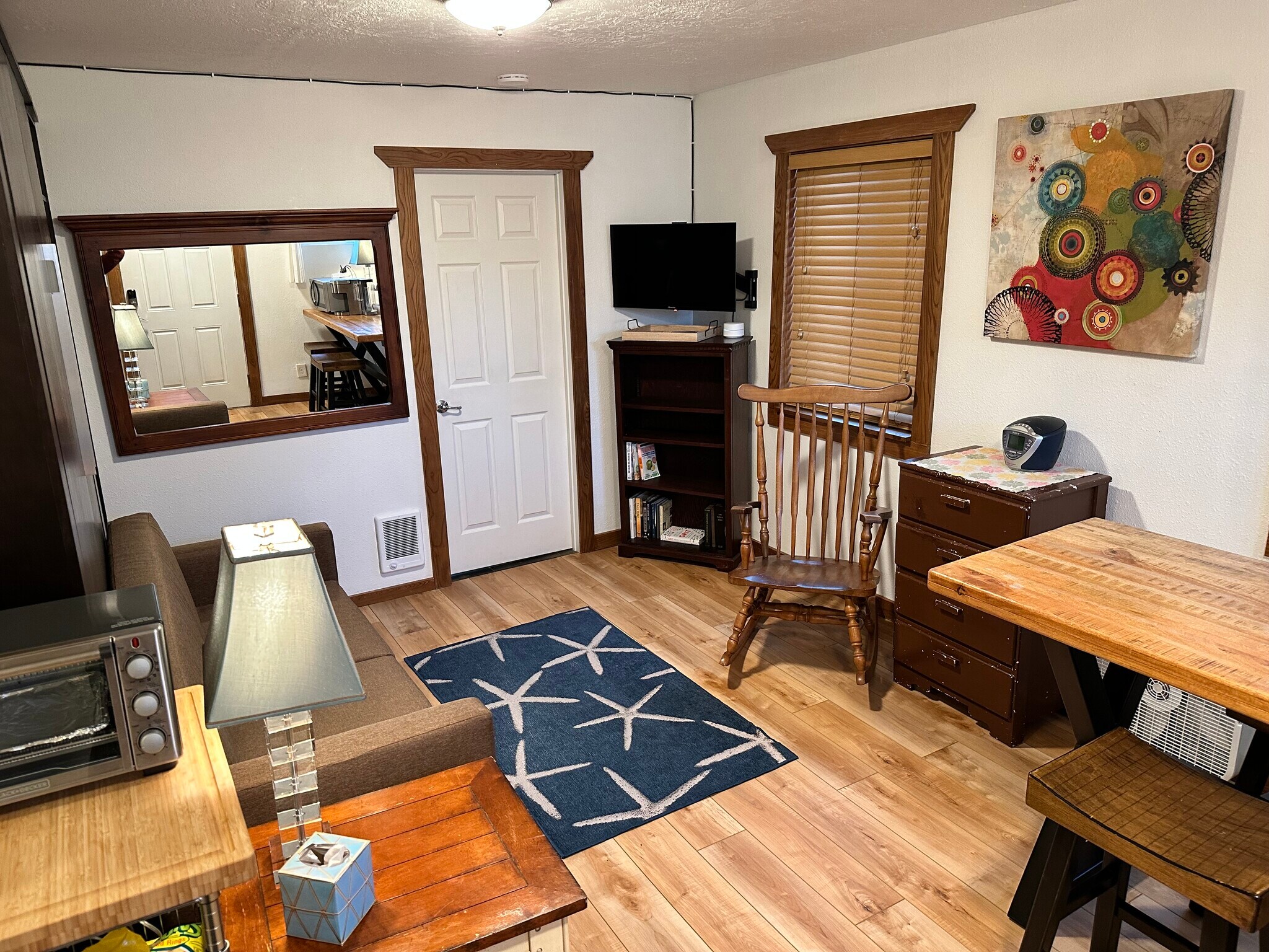 Main room with wall bed raised - 910 N. Pacific Hwy