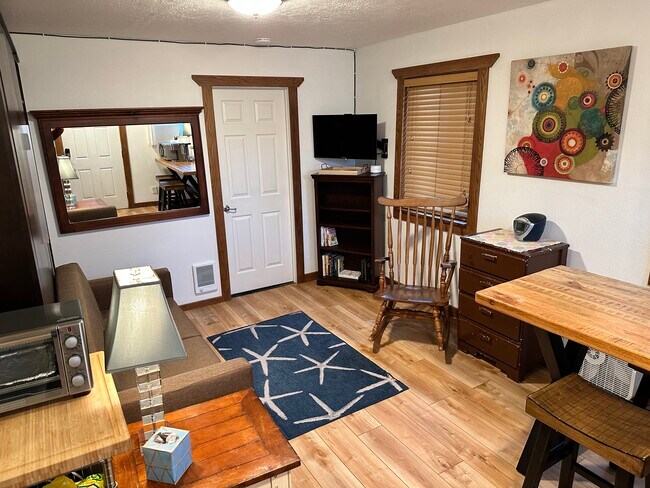 Main room with wall bed raised - 910 N. Pacific Hwy