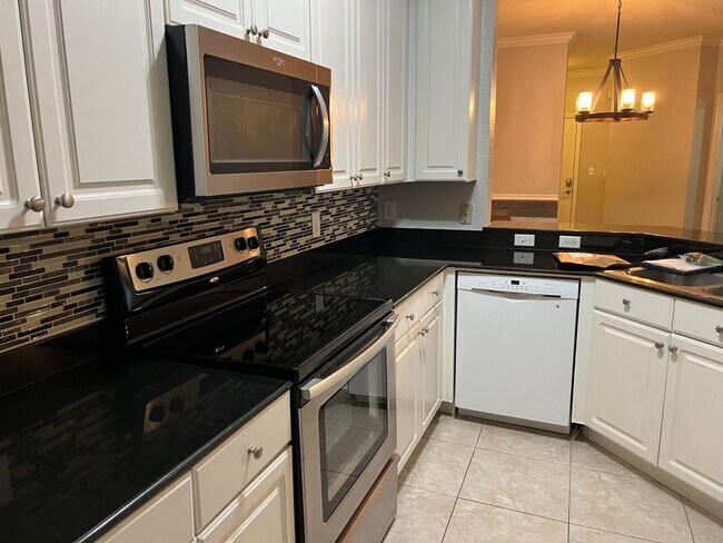 Building Photo - Spacious 3BR/2BA Gated Condo with Resort-Style Amenities!