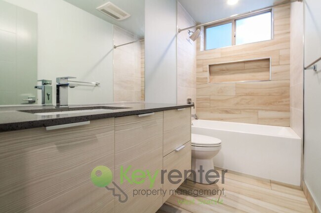 Building Photo - Modern 3 Bedroom with Rooftop Deck and In Unit Laundry
