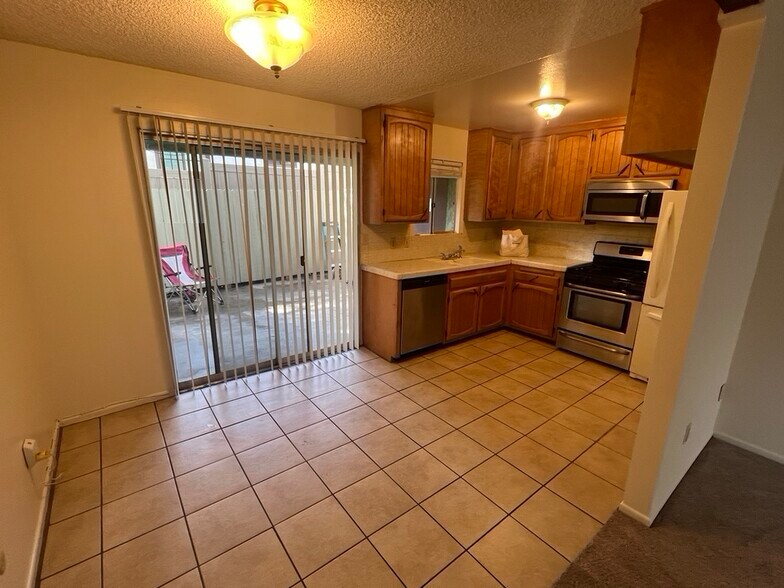 well quipped kitchen with view of patio - 3262 Montrose Ave
