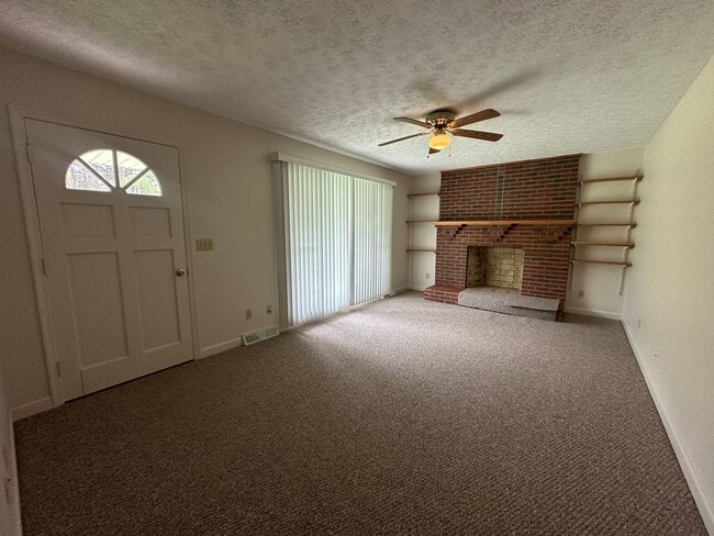 Building Photo - Spacious brick house with a caport and unf...