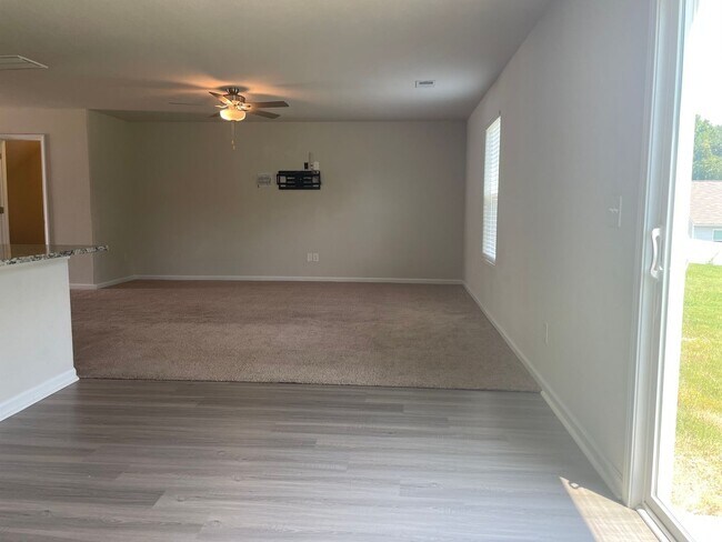Building Photo - Spacious 3-bedroom with a massive Owner's Retreat and Dual Closets.