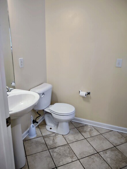 downstairs half bath - 828 Melanie Ln