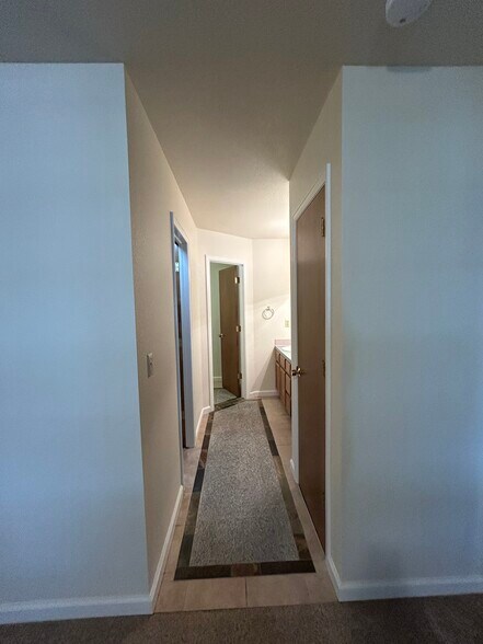 Primary bathroom features a walk-in closet and a linen closet for plenty of storage. - 4393 N Lincoln Ave