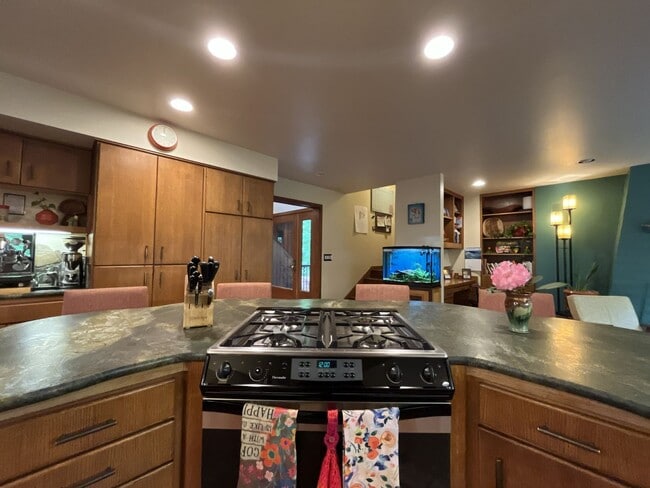 Building Photo - One-of-a-Kind Custom Home with Wall of Windows, Stone Fireplaces, Expansive Entertainment Space &...