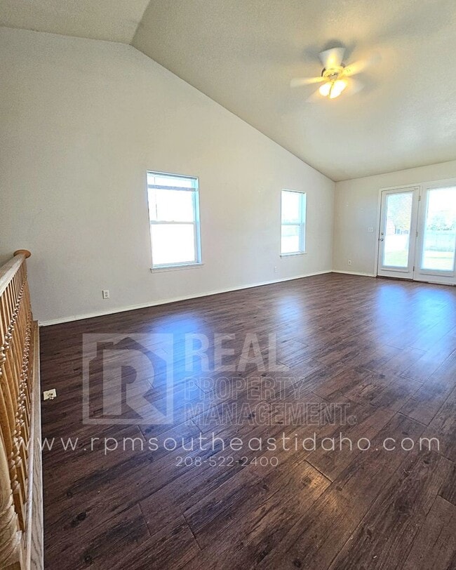 Building Photo - Spacious & Updated 2 Bedroom, 2 Bathroom Twin Home in Ammon with Garage, Fenced Backyard, and Hoo...