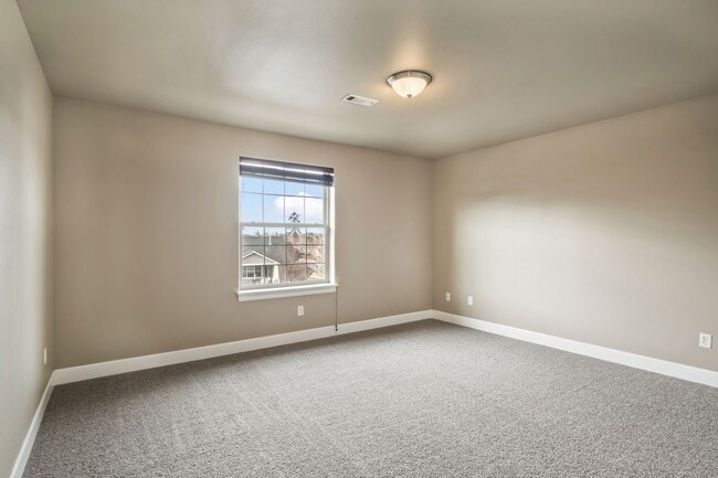 Building Photo - Spacious 4-Bedroom Home with New Paint & Carpet, Fenced Yard