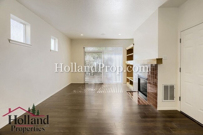 Building Photo - Charming 3-Bedroom Home with Wood Floors, Gas Fireplace & Private Patio