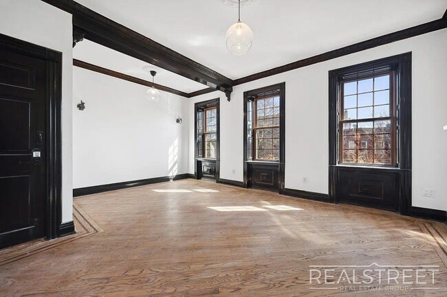 Building Photo - Timelessly Renovated Historic Triplex with...