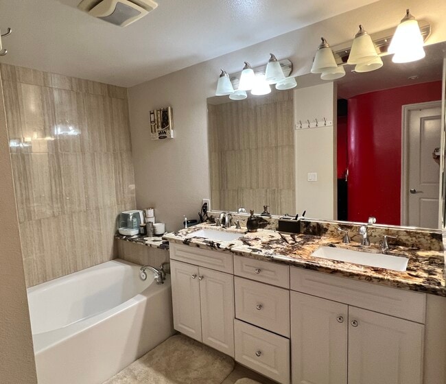 Remodeled master bathroom with modern tiles and countertops - 89 E Commonwealth Ave