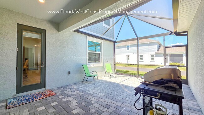Building Photo - EXCEPTIONAL AND SPACIOUS FURNISHED TOWNHOME WITHIN WATERSIDE- NAUTIQUE!