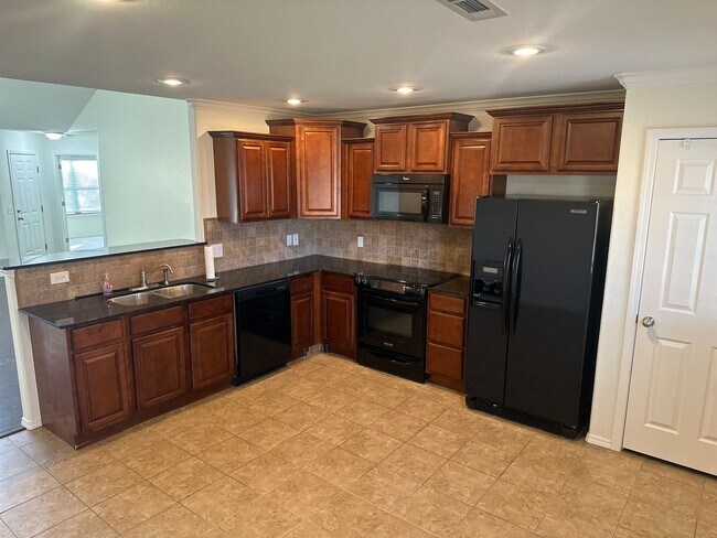 Building Photo - Available Now! Beautiful 4-Bedroom, 2-Bathroom Springdale Home w/ Fenced-In Yard and Covered Patio