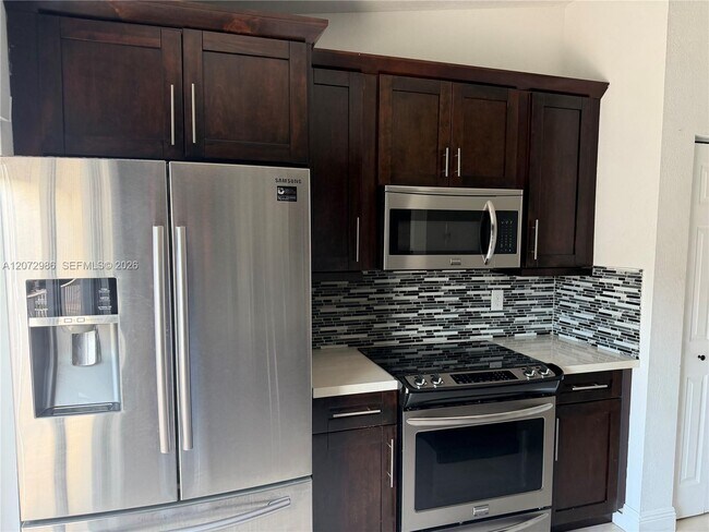 Building Photo - 7040 NW 173rd Dr