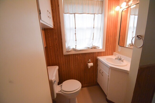 Building Photo - Beautiful multi-level with Gorgeous Yard and LOTS of Storage!