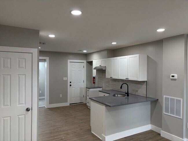 Building Photo - Newly Renovated 2- Story Townhome with Front Porch and Back Yard