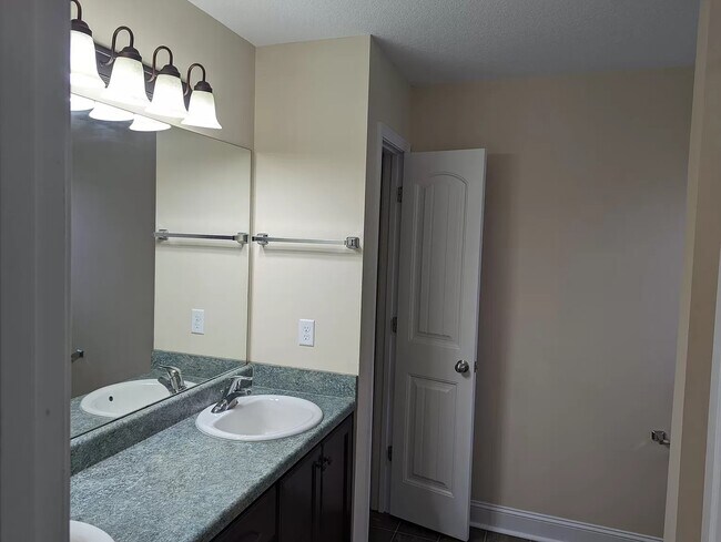Master bath dual vanity sinks and linen closet - 210 Guyett Ave