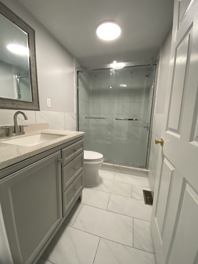 2nd Modern spacious full bath, large shower, porcelain tile floor, granite countertop - 1618 Fitzwater St